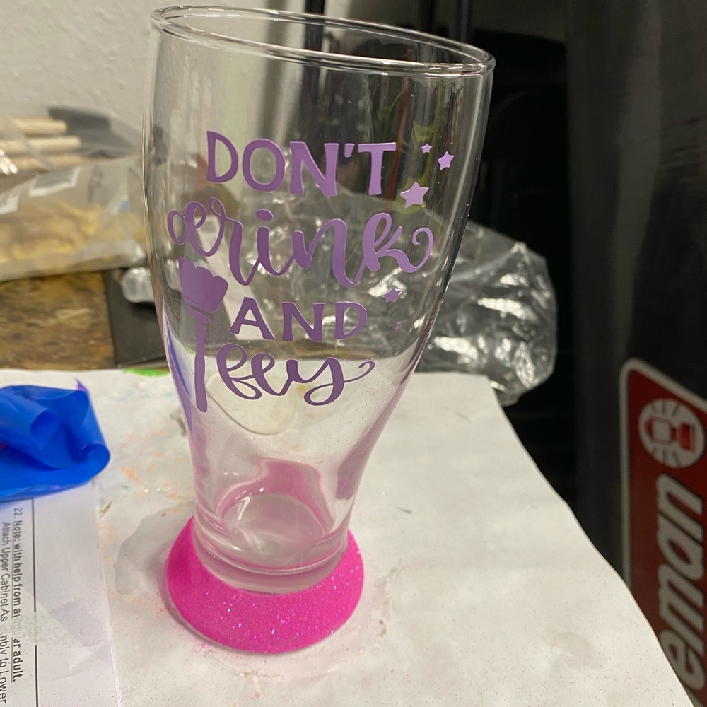 Don’t drink and fly glittered drinking glass